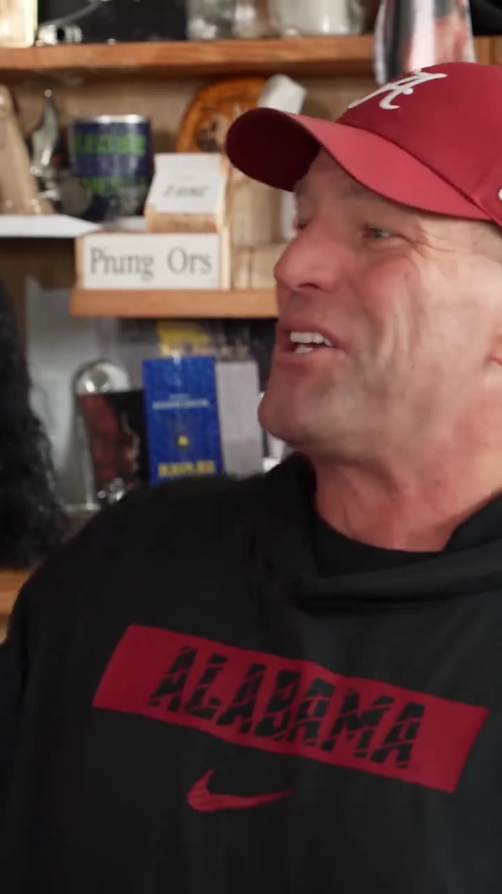 Red-cap lead with a full coach band at a cluttered office desk